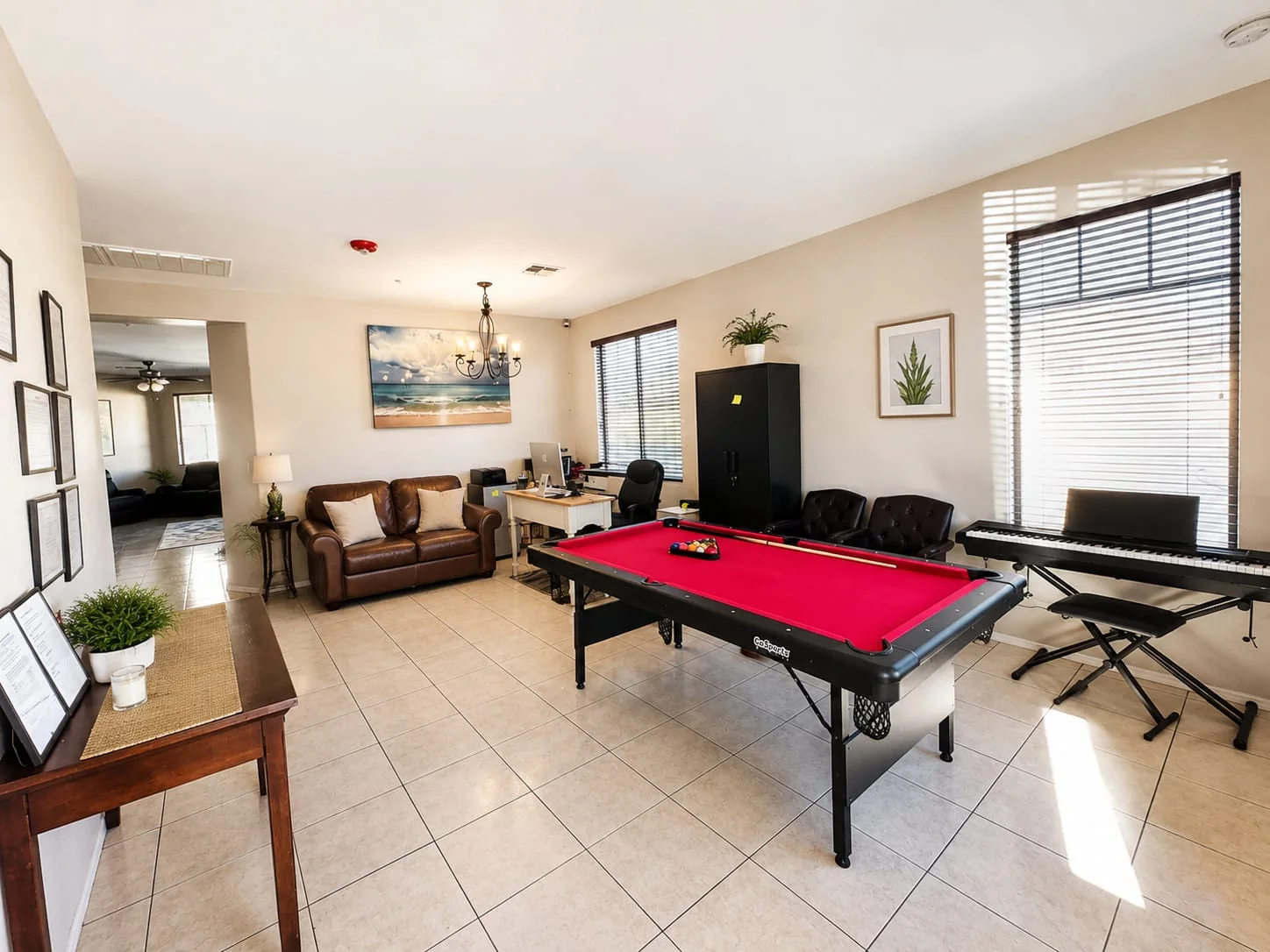 Activity room with seating, pool table, and piano